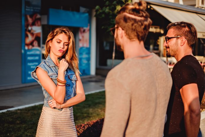 Girl choosing between two man