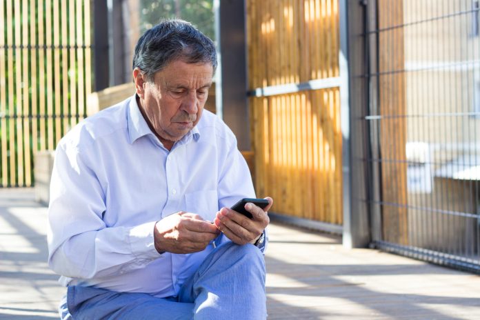 Senior man and his smartphone