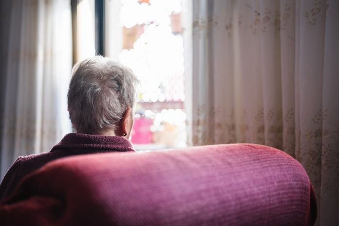 unrecognizable elderly woman alone at home.concept loneliness in old age and mental illness.